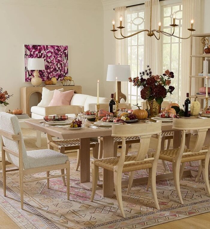 Fall dining room styled for entertaining with a layered table and open shelving