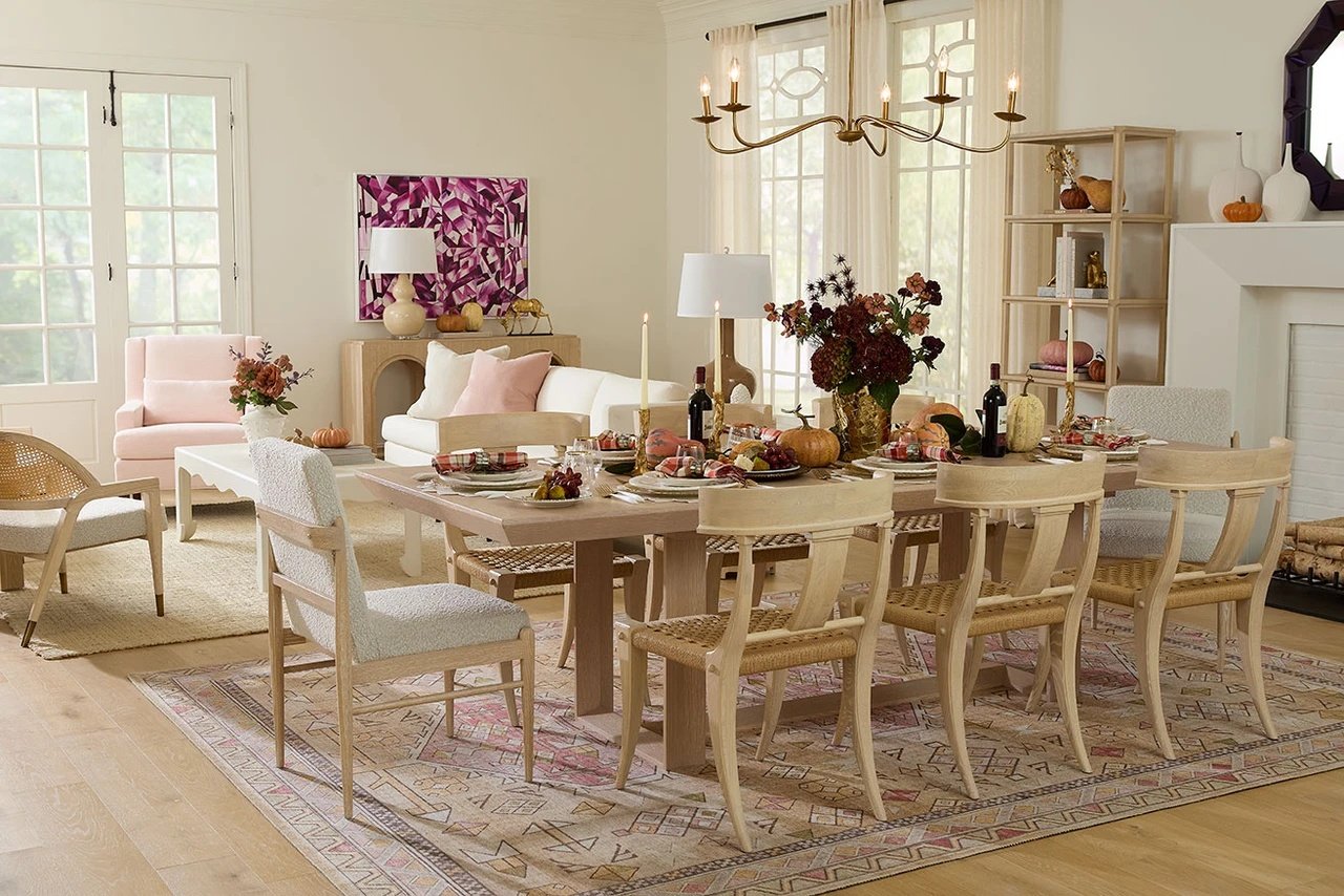 Fall dining room styled for entertaining with a layered table and open shelving