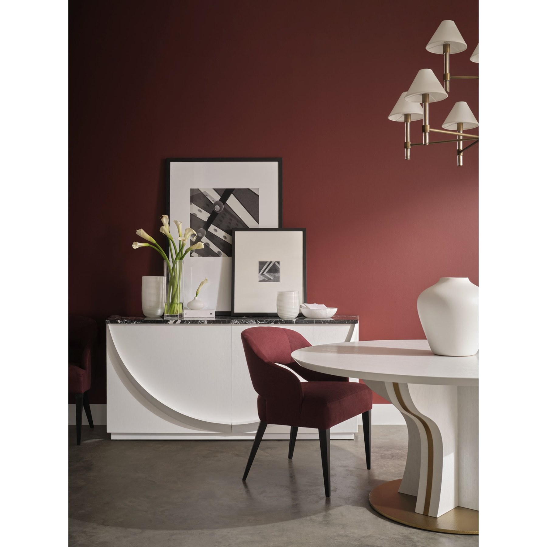 Dining room with a rich merlot wall and warm, layered palette from Baker