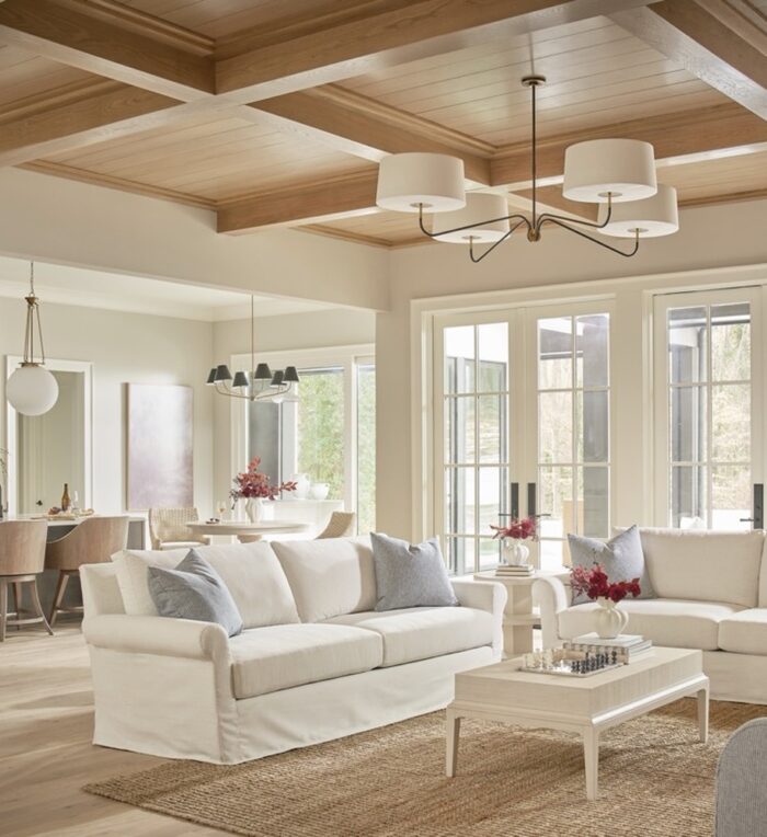An open concept great room with the living, dining, and kitchen zones flowing together